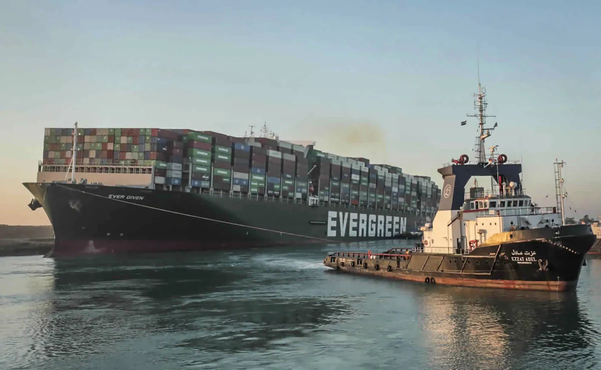 The Ever Given, a Panama-flagged cargo ship, is pulled by one of the Suez Canal tugboats, in the Suez Canal, Egypt, on March 29, 2021. (Suez Canal Authority via AP)