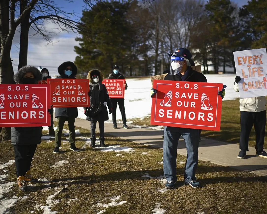People protest outside the Tendercare Living Centre long-term-care facility during the COVID-19 pandemic in Scarborough, Ont., on December 29, 2020. (Nathan Denette / The Canadian Press)