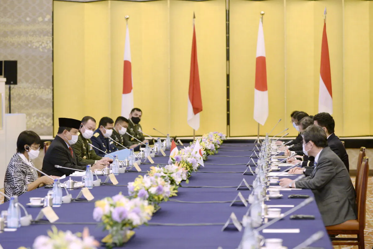 Indonesian Foreign Minister Retno Marsudi and Defense Minister Prabowo Subianto speak with Japanese Foreign Minister Toshimitsu Motegi and Defense Minister Kishi Nobuo during the "two-plus-two" meeting between Japan and Indonesia at the Iikura Guesthouse of the Foreign Ministry in Tokyo, Japan March 30, 2021. (David Mareuil/Pool via Reuters)