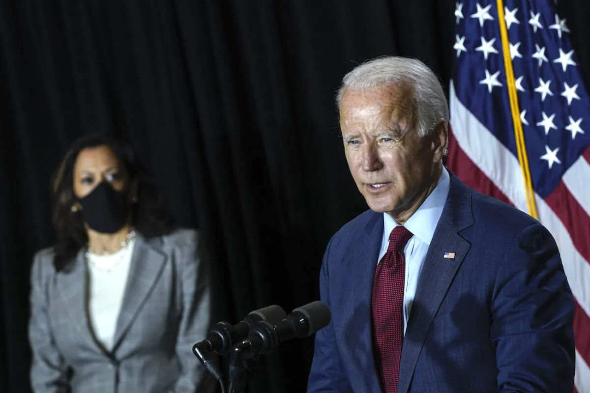 Then-presumptive Democratic vice presidential nominee, U.S. Sen. Kamala Harris listens as presumptive Democratic presidential nominee Joe Biden speaks at the Hotel DuPont in Wilmington, Del., on Aug. 13, 2020. (Drew Angerer/Getty Images)