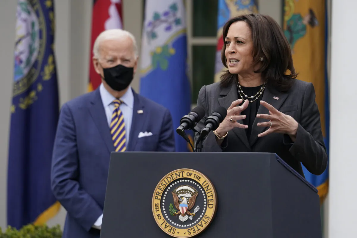 President Joe Biden listens as Vice President Kamala Harris speaks about the American Rescue Plan in the Rose Garden of the White House in Washington. (Alex Brandon/AP Photo)