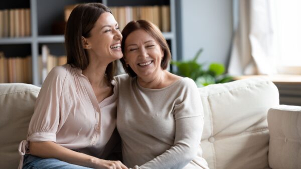 mon and daughter laughing