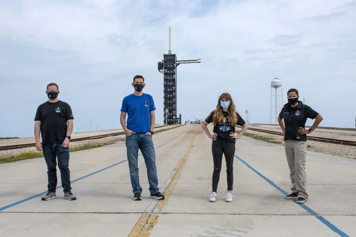 (L-R) Chris Sembroski, Jared Isaacman, Hayley Arceneaux, and Sian Proctor pose for a photo, at the SpaceX launch pad at NASA’s Kennedy Space Center at Cape Canaveral, Fla., on March 29, 2021.  (SpaceX via AP)