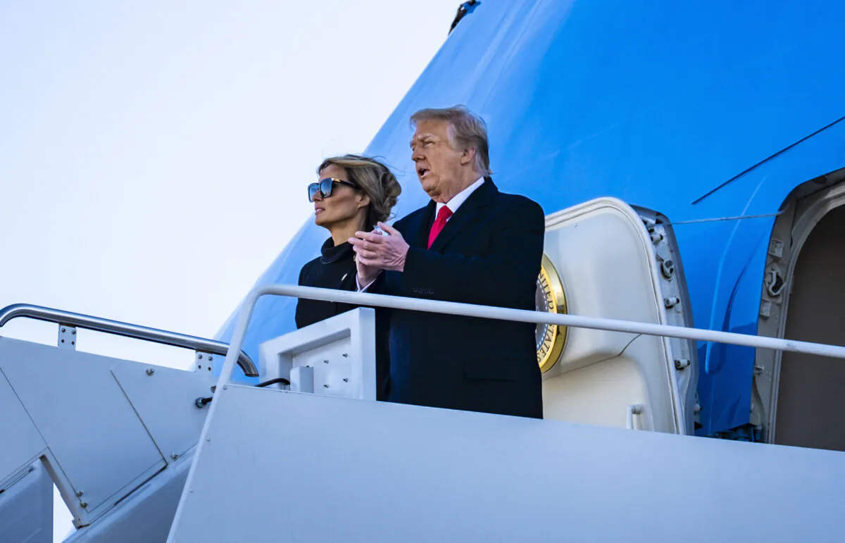 President Donald Trump and First Lady Melania Trump board Air Force One at Joint Base Andrews for the last time as President on Jan. 20, 2021. (Pete Marovich for The New York Times)