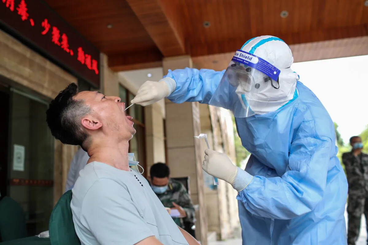 A resident is tested for the COVID-19 in Ruili in southwestern China's Yunnan Province on Sept. 15, 2020. (STR/AFP via Getty Images)