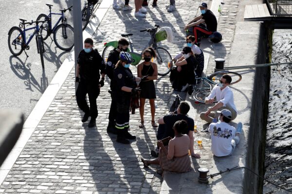 People enjoy a sunny and warm weather in Paris