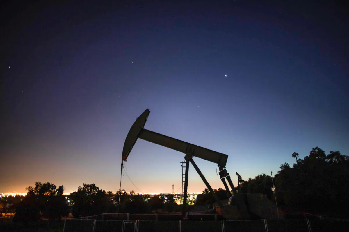 An oil pumpjack operates at dusk Willow Springs Park in Long Beach, Calif., on April 21, 2020. (Apu Gomes/AFP via Getty Images)