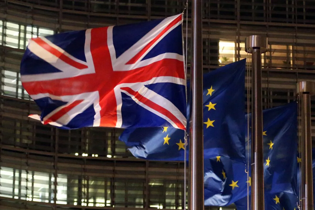 A Union Jack and EU flags fluttering outside the Berlaymont building, the European commission headquarters, on Dec. 9, 2020. (Francois Walschaerts/AFP via Getty Images)