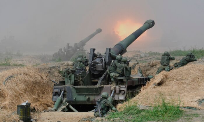 Two 8-inch self-propelled artillery guns are fired during the 35th Han Kuang military drill in southern Taiwan's Pingtung county on May 30, 2019. (Sam Yeh/AFP via Getty Images)