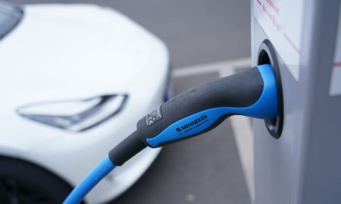 A Tesla electric car charges at a public charging station in the city center of Berlin, Germany, on Dec. 11, 2020. (Sean Gallup/Getty Images)