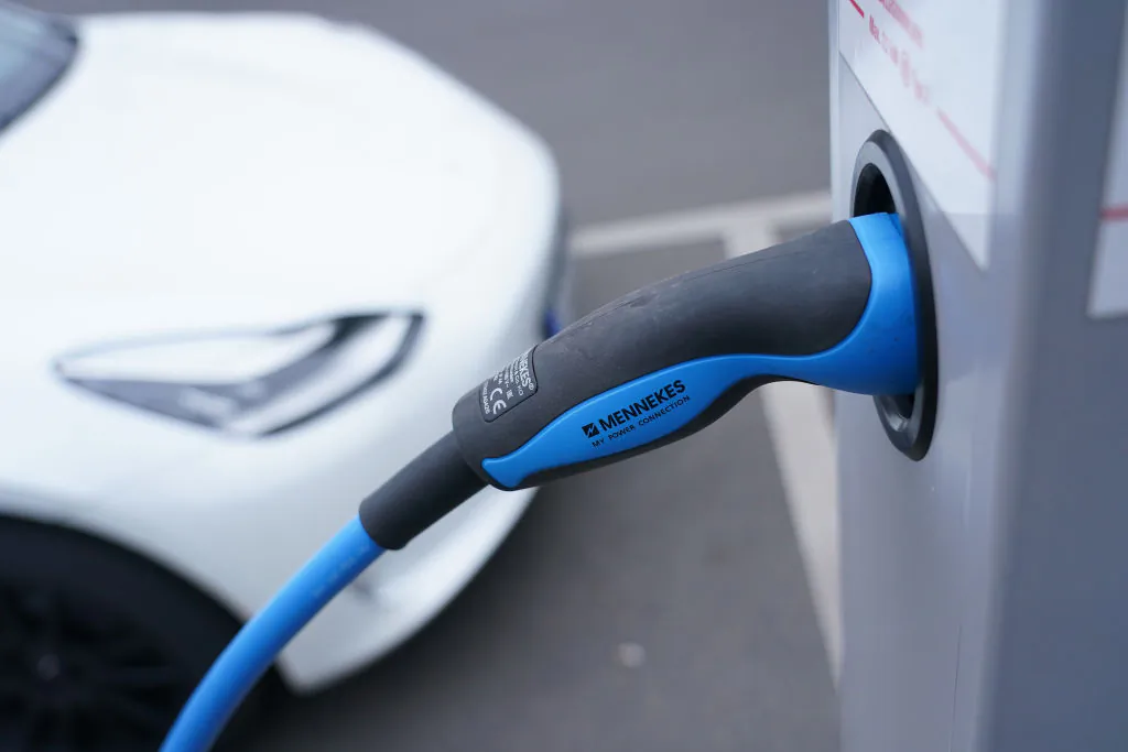 A Tesla electric car charges at a public charging station in the city center of Berlin, Germany, on Dec. 11, 2020. (Sean Gallup/Getty Images)