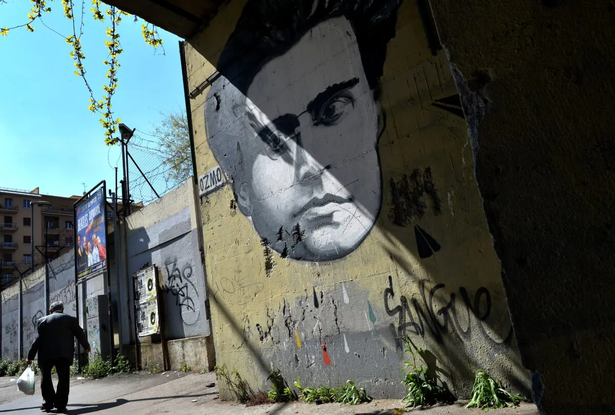 A graffiti by Italian artist Ozmo depicting Italian communist Antonio Gramsci covers a wall in Rome on March 31, 2014. (Alberto Pizzoli/AFP via Getty Images)