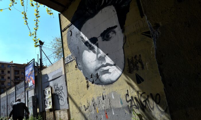 A graffiti by Italian artist Ozmo depicting Italian communist Antonio Gramsci covers a wall in Rome on March 31, 2014. (Alberto Pizzoli/AFP via Getty Images)