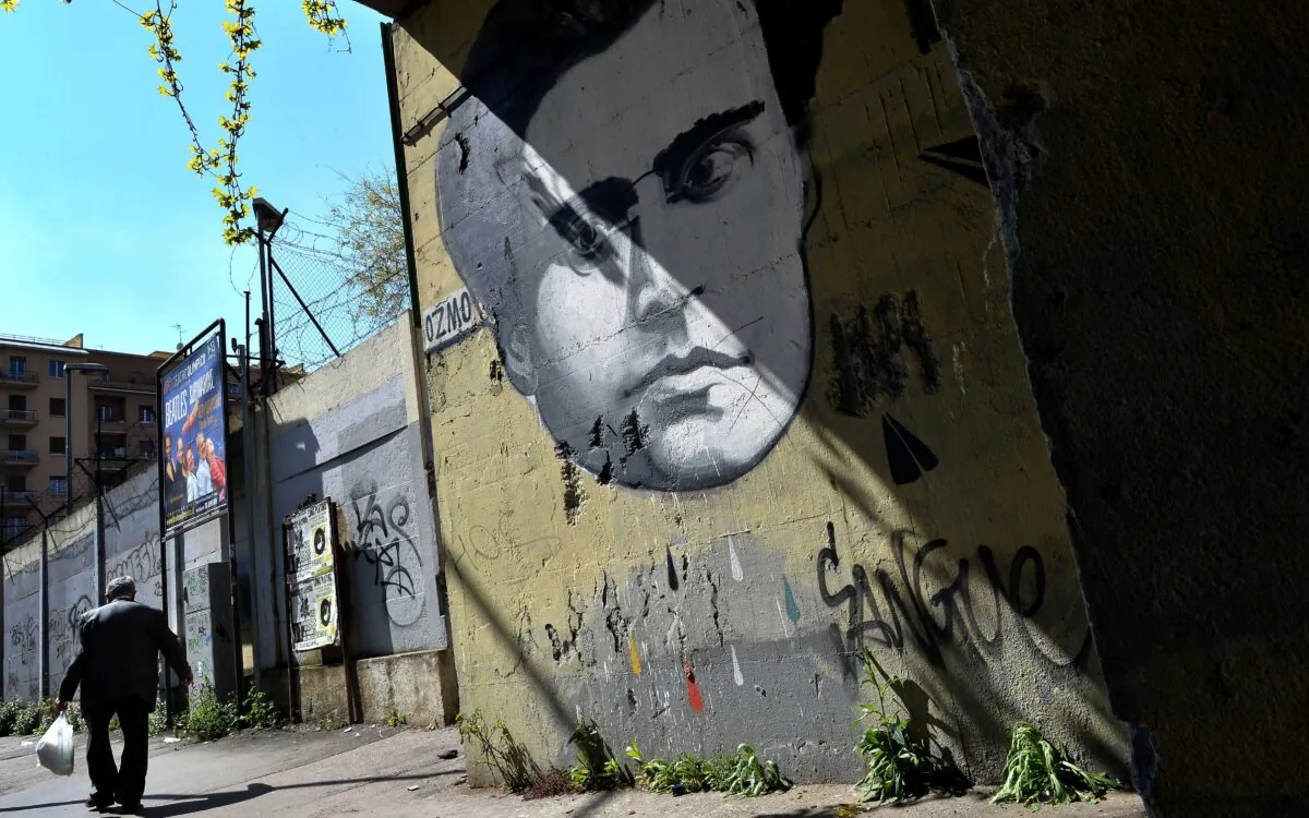 A graffiti by Italian artist Ozmo depicting Italian communist Antonio Gramsci covers a wall in Rome on March 31, 2014. (Alberto Pizzoli/AFP via Getty Images)