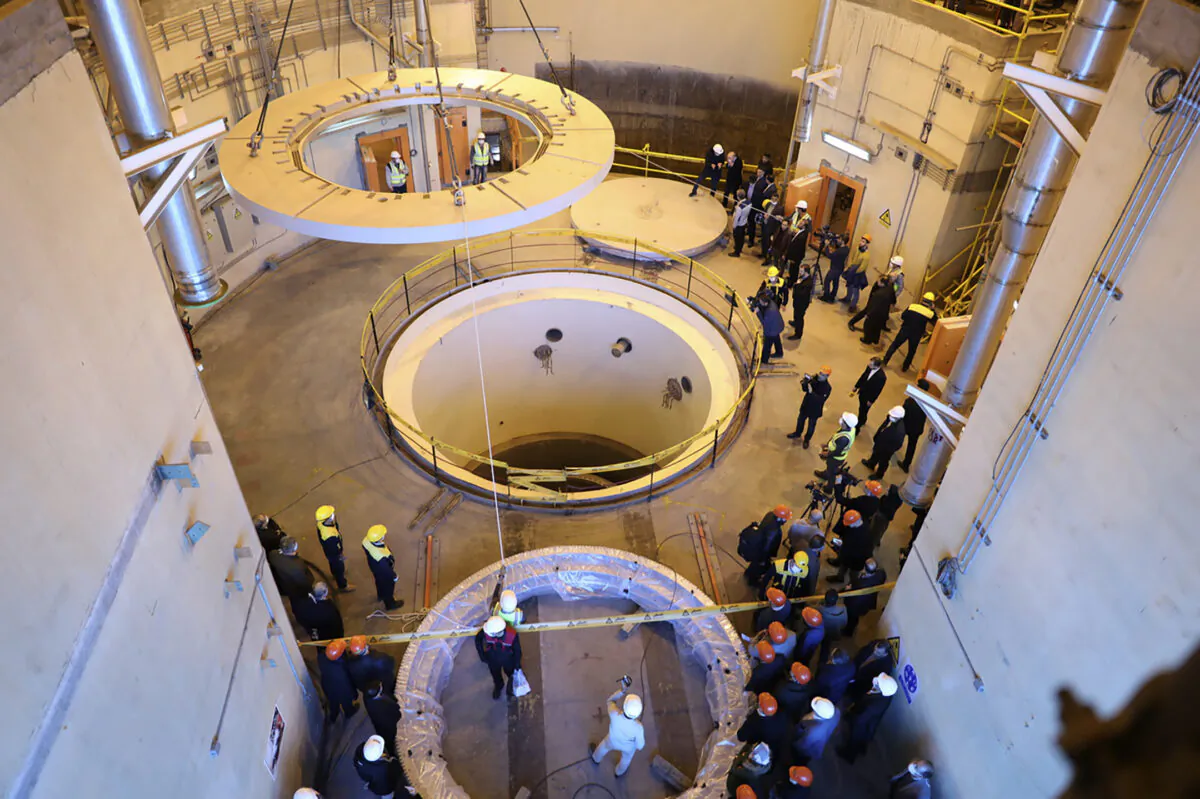 Technicians work at a nuclear facility as officials and media visit the site, about 150 miles southwest of Tehran, Iran, on Dec. 23, 2019. (Atomic Energy Organization of Iran via AP, File)