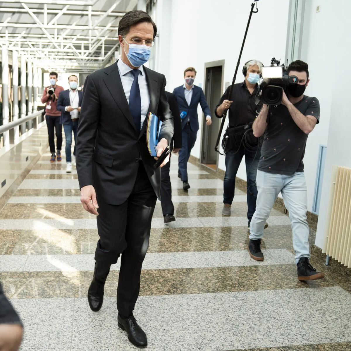 Dutch outgoing Prime Minister Mark Rutte of the VVD party leaves during a suspension of a debate at the Parliament's Lower House in The Hague on April 1, 2021. (Bart Maat/ANP/AFP via Getty Images)