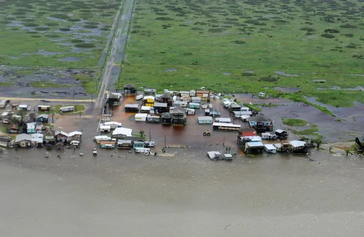 Housing surrounded by flood waters caused by Hurricane Harvey is seen from a U.S. Coast Guard helicopter during an overflight from Port Aransas to Port O'Connor, Texas, on Aug. 26, 2017. (U.S. Coast Guard/Petty Officer 3rd Class Johanna Strickland/File/Handout via Reuters)