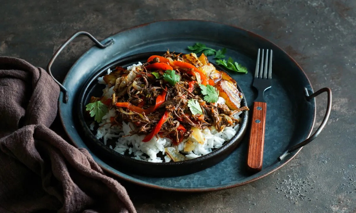 Cuba's version of this Spanish import braises beef in a lush tomato-based sauce until it can be shredded. (Julia-Bogdanova/shutterstock)