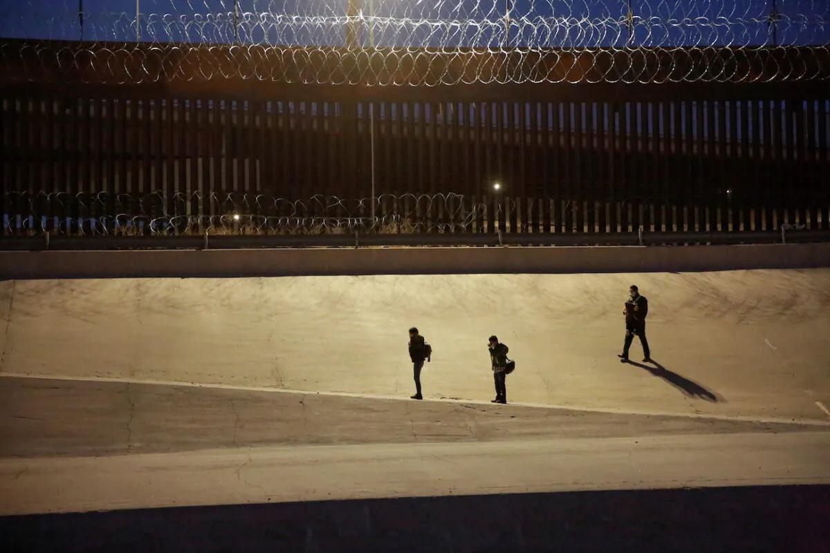 Migrants are seen after crossing the Rio Bravo river to turn themselves in to U.S. Border Patrol agents in El Paso, Texas, on March 4, 2021. (Jose Luis Gonzalez/Reuters)