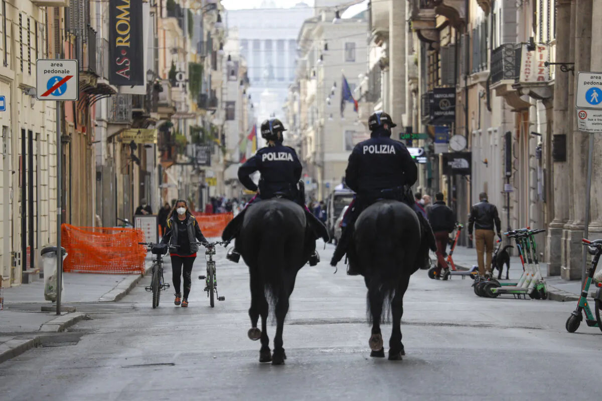 Mounted police officers patrol Via del Corso main shopping street in downtown Rome on April 3, 2021. (Gregorio Borgia/AP)