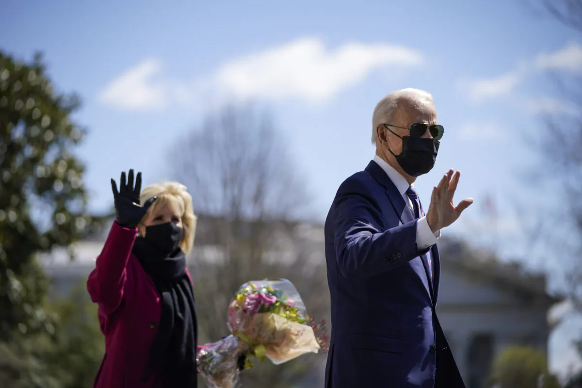 President Joe Biden, left, waves as he and First Lady Jill Biden leave the White House in Washington on April 2, 2021. (Drew Angerer/Getty Images)