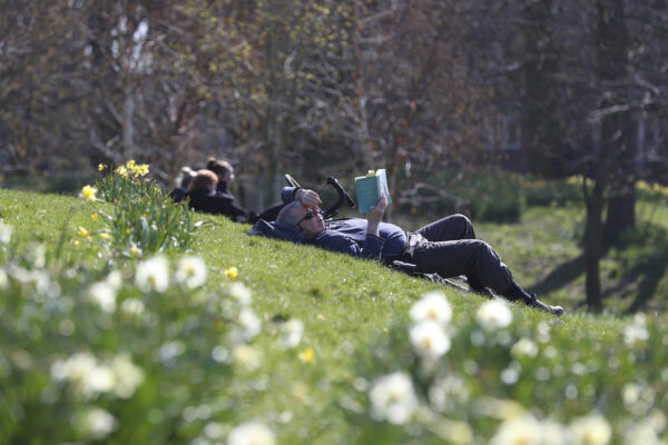 People enjoy the sunny weather in Sefton Park in Liverpool