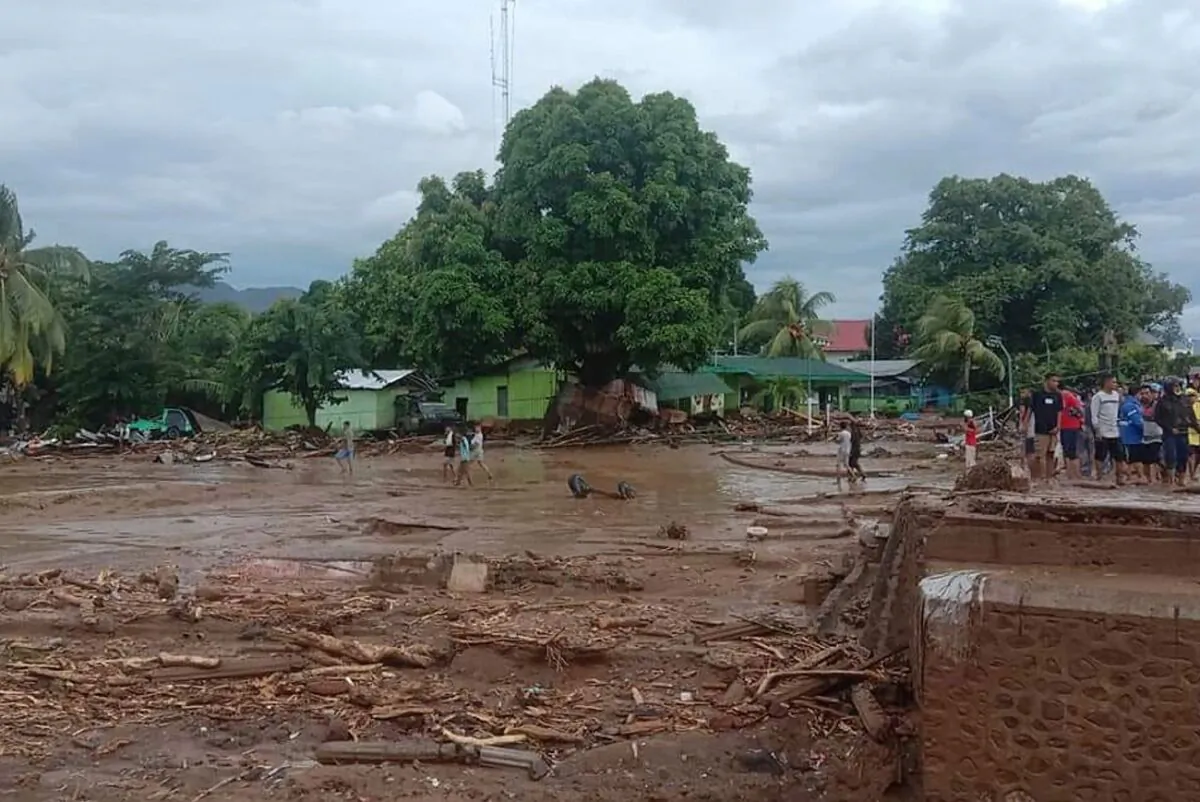 Residents inspect the damage at a village hit by flash flood in East Flores, Indonesia, on April 4, 2021. (Ola Adonara/AP Photo)