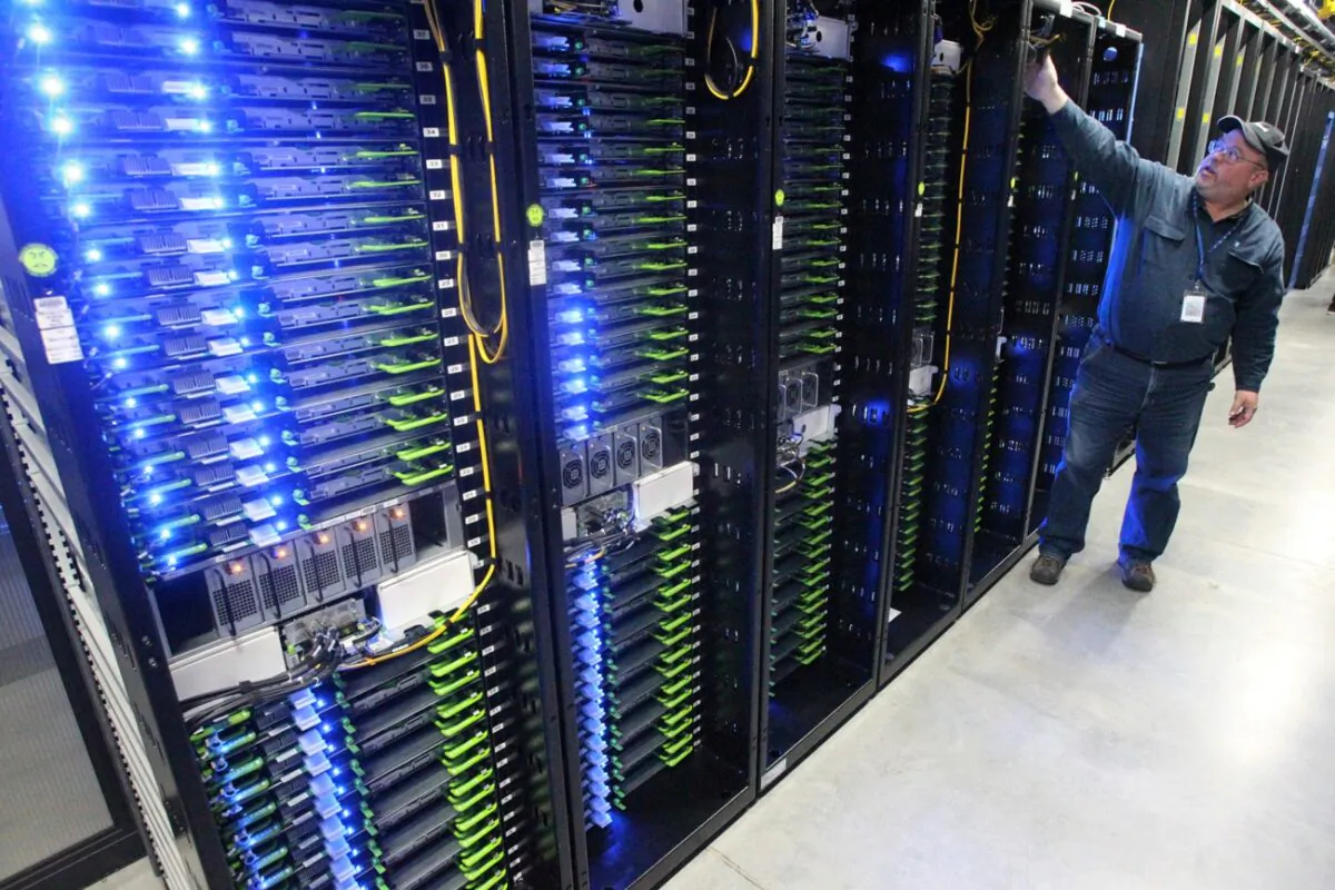Chuck Goolsbee, site director for Facebook's Prineville data centers, shows the computer servers that store users' photos and other data at the Facebook site in Prineville, Ore., on Oct. 15, 2013. (Andy Tullis/The Bulletin via AP)
