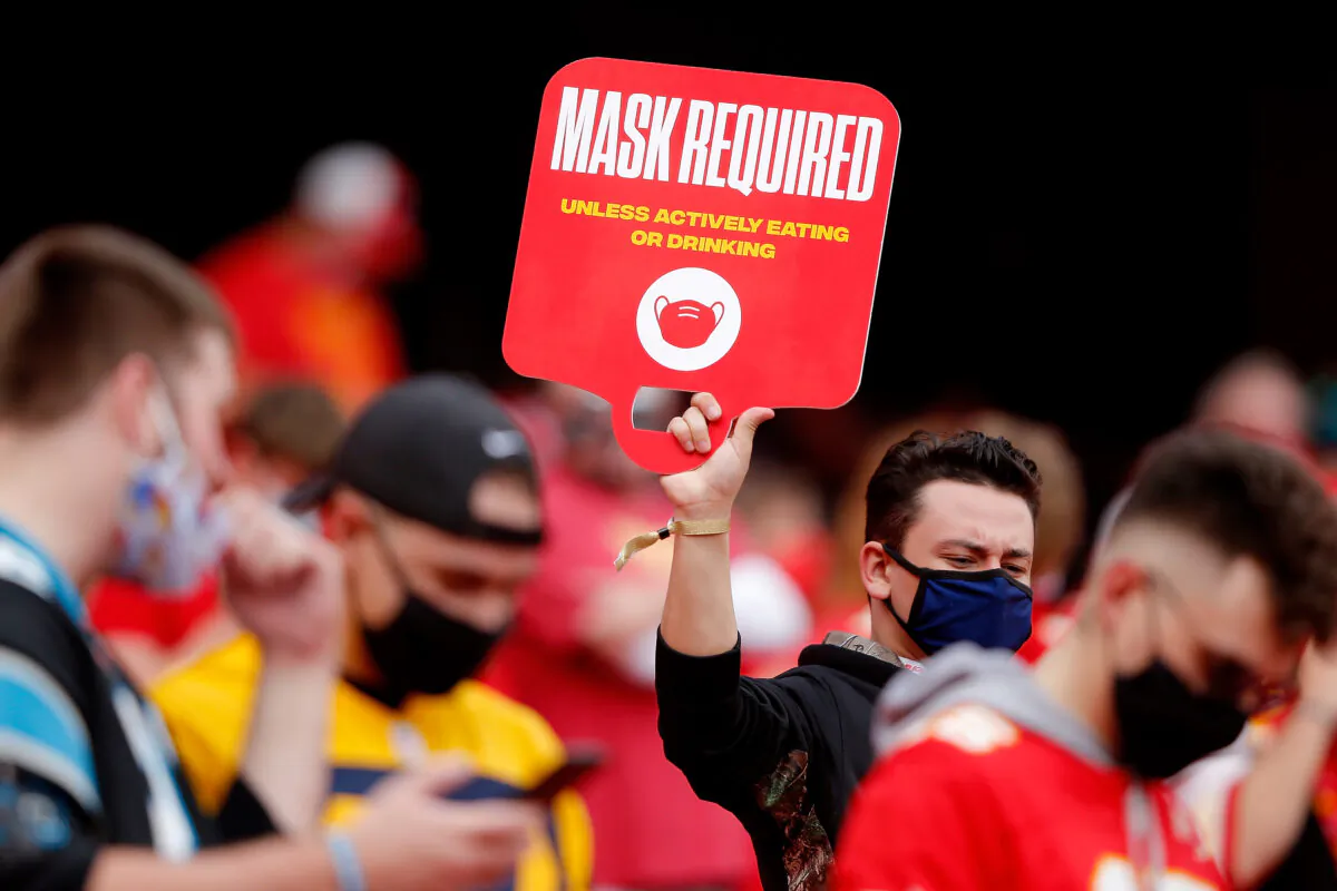 Spectators are reminded of mask requirements as the Kansas City Chiefs play the Carolina Panthers at Arrowhead Stadium in Kansas City, Mo., on Nov. 8, 2020. (David Eulitt/Getty Images)