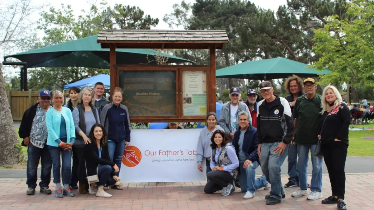 Our Father's Table volunteers gather during a pre-COVID event in San Juan Capistrano. (Courtesy of Our Father's Table)