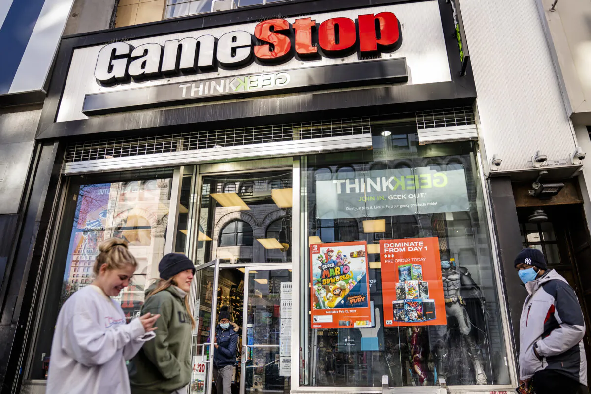 Pedestrians pass a GameStop store on 14th Street at Union Square in Manhattan, New York, on Jan. 28, 2021. (John Minchillo/AP Photo)