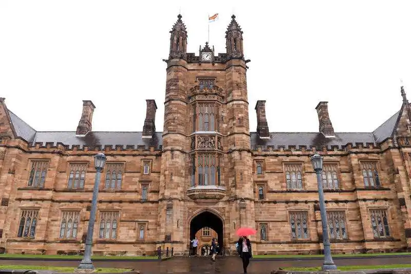 Students walk from the quadrangle at the University of Sydney, in Sydney on Thursday, Sept. 22, 2016. (AAP Image/Paul Miller)