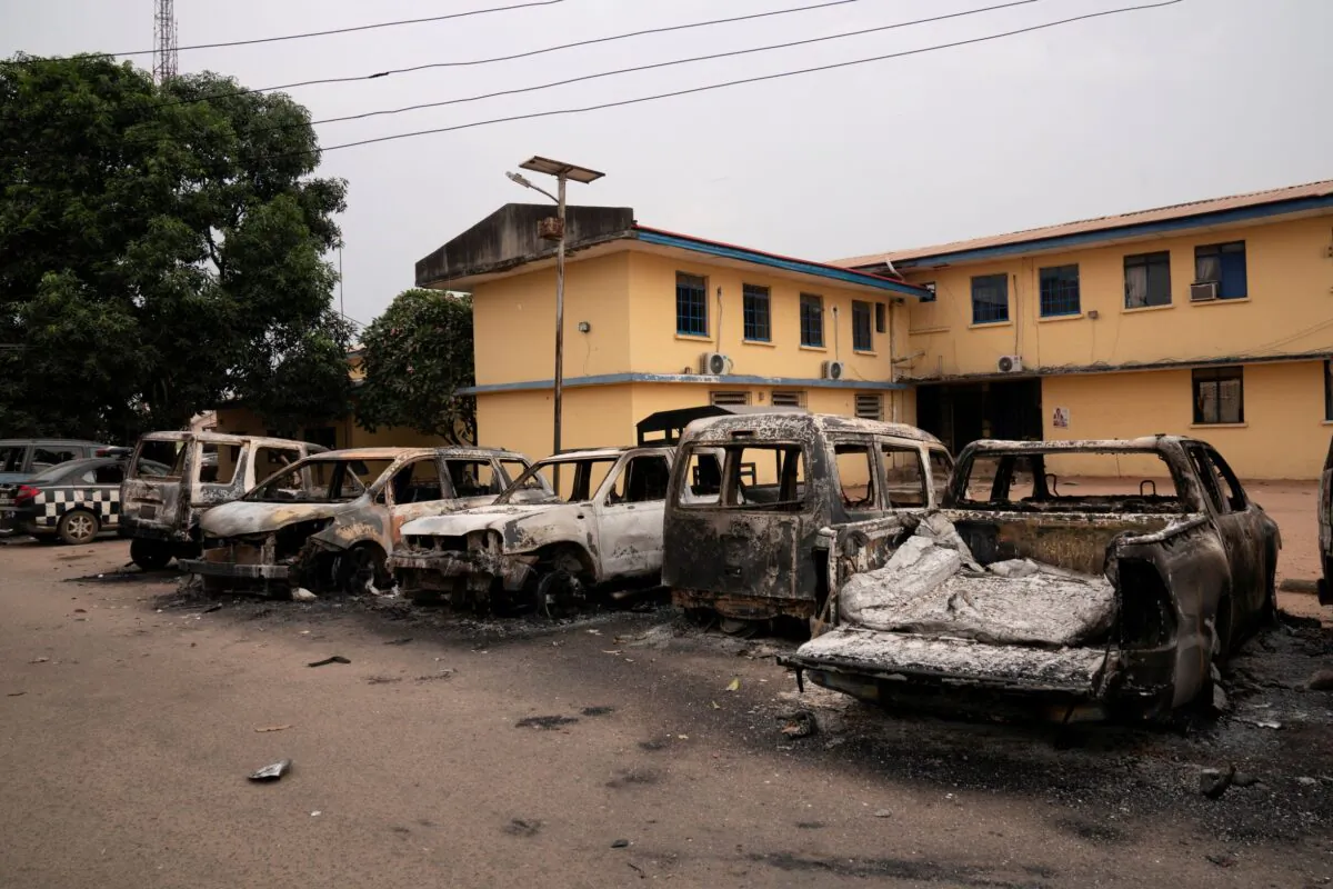 Burnt vehicles are seen outside the Nigeria police force Imo state command headquaters after gunmen attacked and set properties ablaze in Imo State, Nigeria, on April 5, 2021. (David Dosunmu/Handout via Reuters)