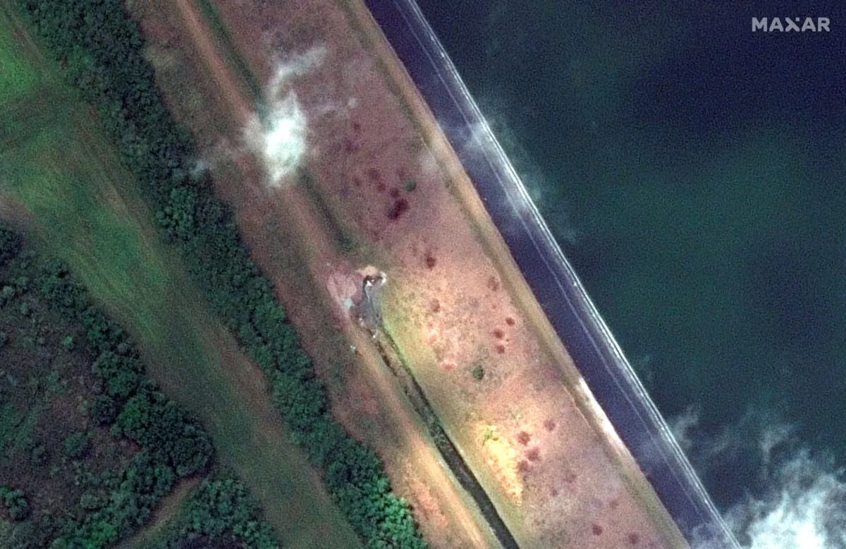 A breach in a retaining pond is shown at the 77-acre Piney Point reservoir in Manatee County, Fla., on April 5, 2021. (Satellite image ©2021 Maxar Technologies via AP)