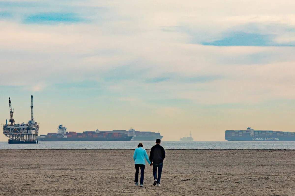 Ships line the horizon seen from Seal Beach, Calif., as they await to come ashore to The Port of Los Angeles, on Jan. 12, 2021. (John Fredricks/The Epoch Times)
