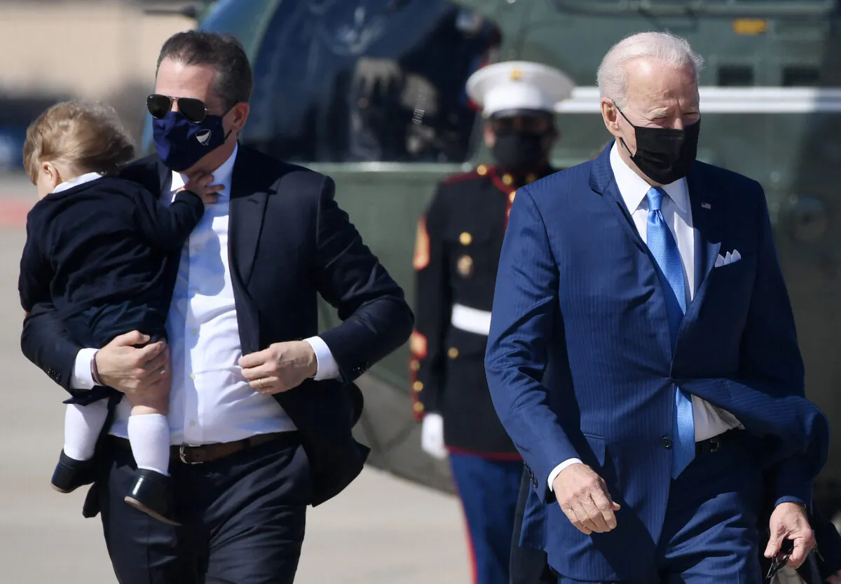 Hunter Biden, left, travels with President Joe Biden to board Air Force One at Joint Base Andrews, Md., on March 26, 2021. (Olivier Douliery/AFP via Getty Images)