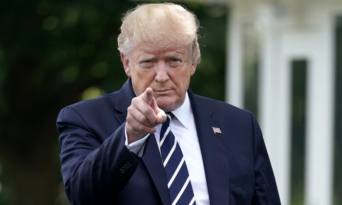 Then-President Donald Trump walks out of the White House before departing in Washington on July 19, 2019. (Chip Somodevilla/Getty Images)