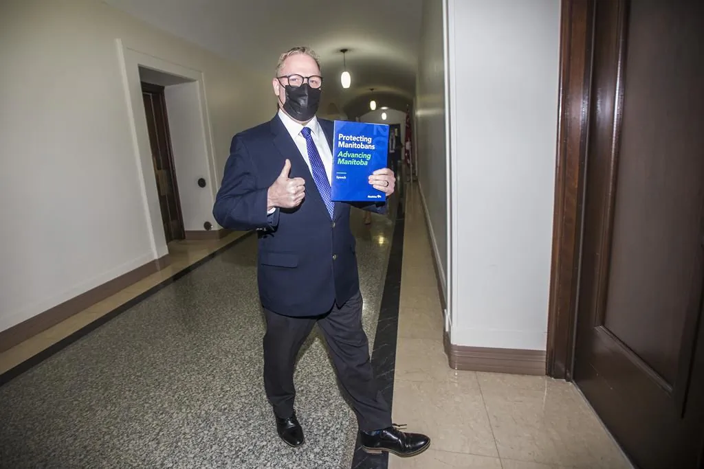 Manitoba finance minister Scott Fielding walks in to speak to the media about the 2021 budget at the Manitoba Legislative Building in Winnipeg on April 7, 2021. (THE CANADIAN PRESS/Mikaela MacKenzie - POOL)