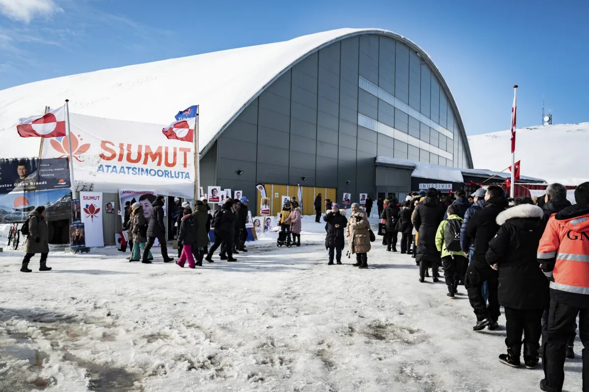 People line up to vote in the Inussivik arena in Nuuk, Greenland, on April 6, 2021. (Emil Helms/Ritzau Scanpix via AP)