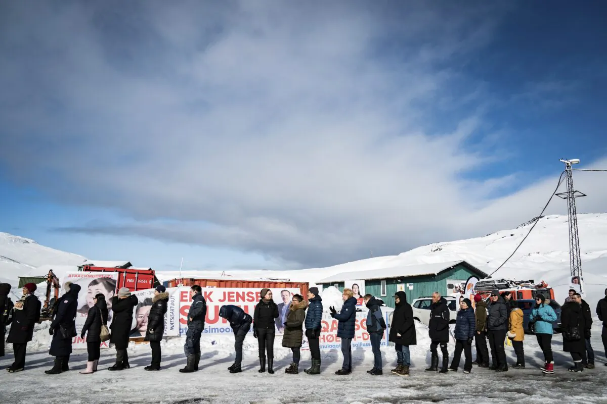 People queue to vote, in the Inussivik arena in Nuuk, Greenland, on April 6, 2021. (Emil Helms/Ritzau Scanpix via AP)