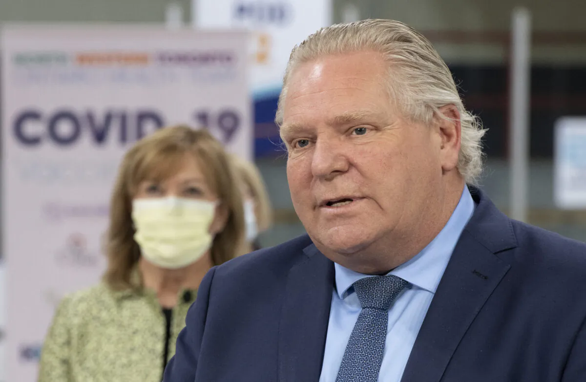 Ontario Premier Doug Ford speaks during the daily briefing at a mass vaccination centre in Toronto, Canada, on March 30, 2021. (Frank Gunn/The Canadian Press)