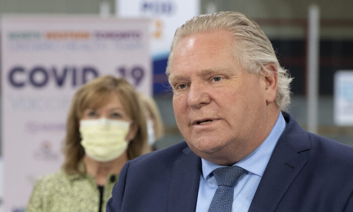 Ontario Premier Doug Ford speaks during the daily briefing at a mass vaccination centre in Toronto, Canada, on March 30, 2021. (Frank Gunn/The Canadian Press)
