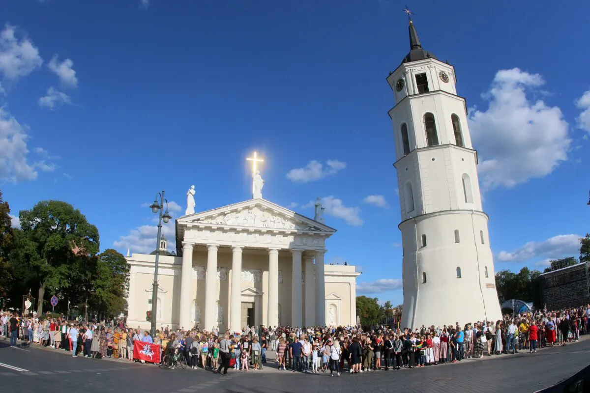 People form a human chain under the motto "The Baltic Way - It's Us" from Gediminas Tower to the City Limits to support Hong Kong pro-democracy activists in Vilnius, Lithuania, on Aug. 23, 2019. (Petras Malukas/AFP via Getty Images)