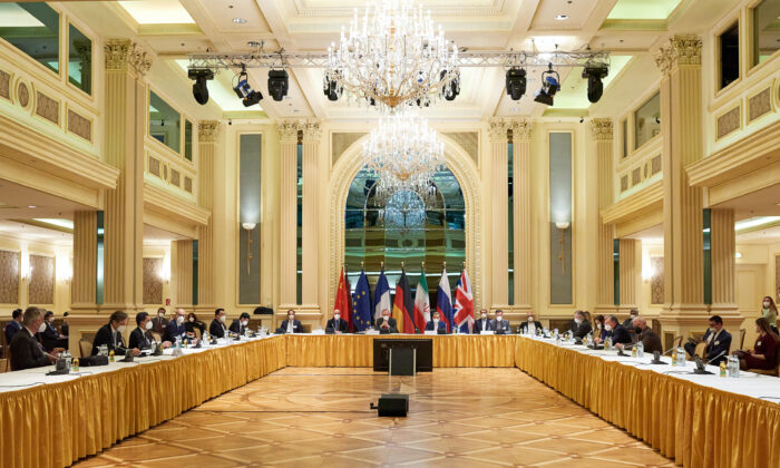 Representatives of the European Union, Iran, and others attend the Iran nuclear talks at the Grand Hotel in Vienna, Austria, on April 6, 2021. Representatives from the United States, Iran, the EU, Russia, China, and other participants from the original Joint Comprehensive Plan of Action (JCPOA) are meeting directly and indirectly over possibly reviving the plan. (EU Delegation in Vienna via Getty Images)
