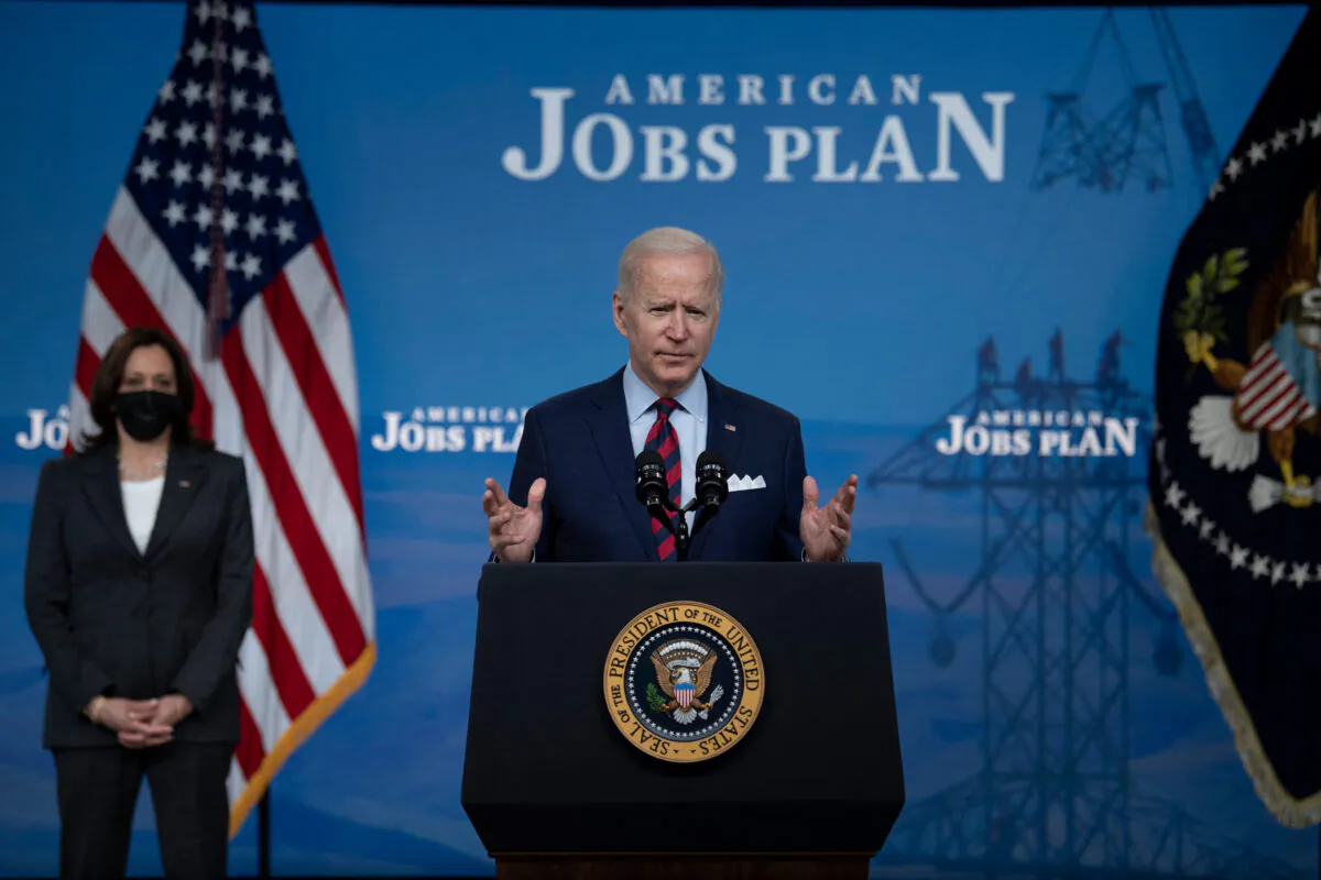 President Joe Biden, with Vice President Kamala Harris, speaks about infrastructure investment from the Eisenhower Executive Office Building on the White House campus in Washington on April 7, 2021. (Brendan Smialowski/AFP via Getty Images)