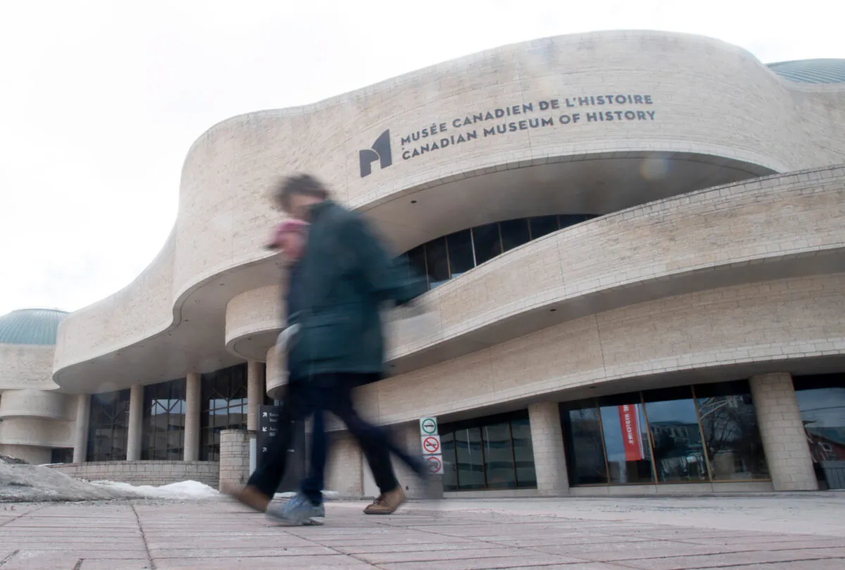 People walk past the Museum of History on March 14, 2020 in Gatineau, Que. The museum was one of many public spaces that closed its doors due to COVID-19. (Adrian Wyld/The Canadian Press)