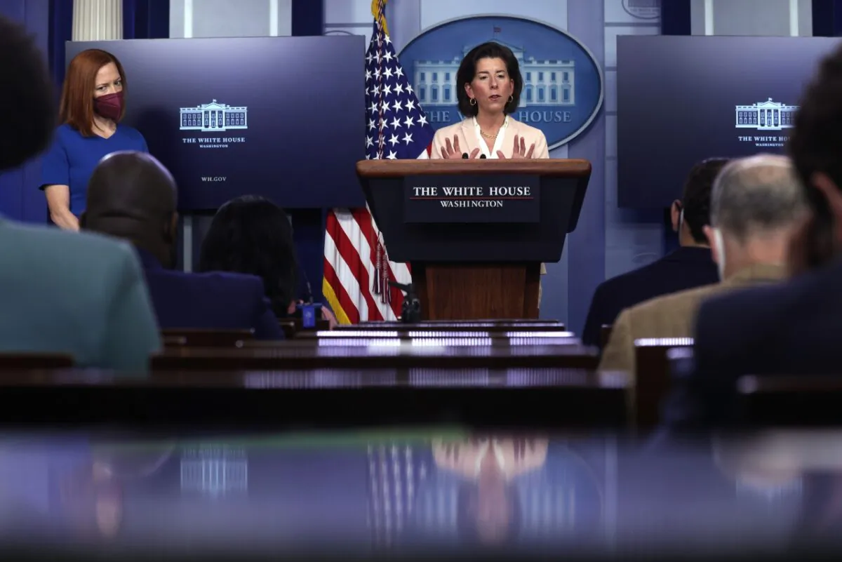 U.S. Secretary of Commerce Gina Raimondo speaks as White House press secretary Jen Psaki looks on during a daily press briefing at the James Brady Press Briefing Room of the White House in Washington on April 7, 2021. (Alex Wong/Getty Images)