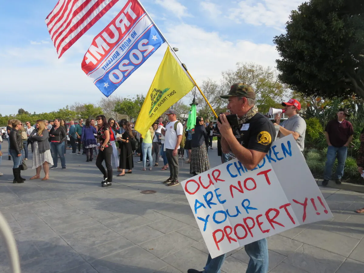 Parents rally outside the Orange County Department of Education in Costa Mesa, Calif., on April 7, 2021. (Mei Li/The Epoch TImes)