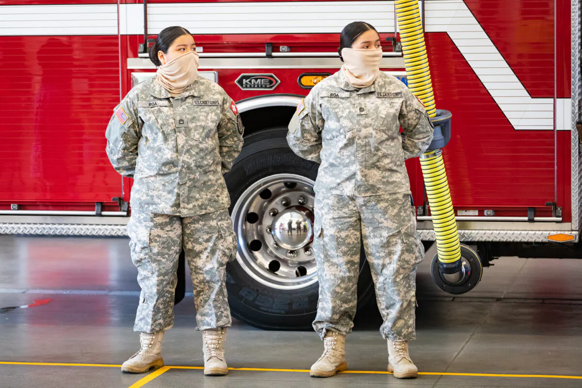 Sisters Ashley and Stephanie Roa await awards for heroism at OCFA Fire Station 61 in Buena Park, Calif., on April 8, 2021. (John Fredricks/The Epoch Times)