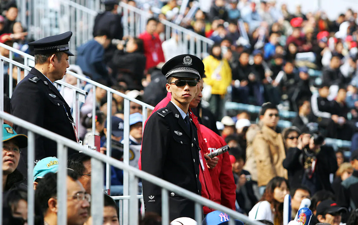 Chinese policemen at the game between the Los Angeles Dodgers and the San Diego Padres at Beijing's Wukesong Stadium in Beijing, on March 16, 2008. (Guang Niu/Getty Images)